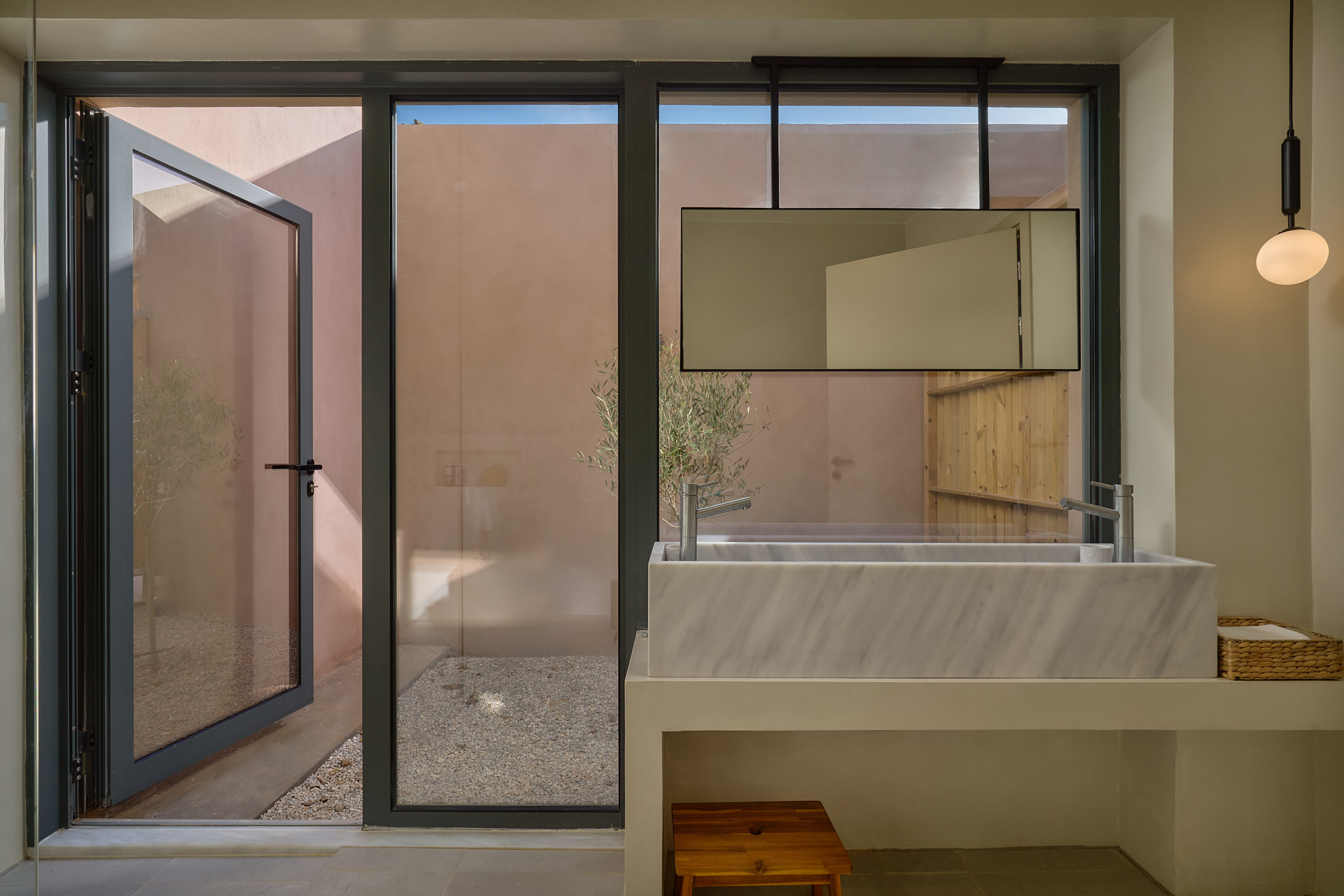 Iconic bathroom settings, located at the "1st suite" ground floor, featuring a walk in shower & double sink with access to an outdoor private terrace.