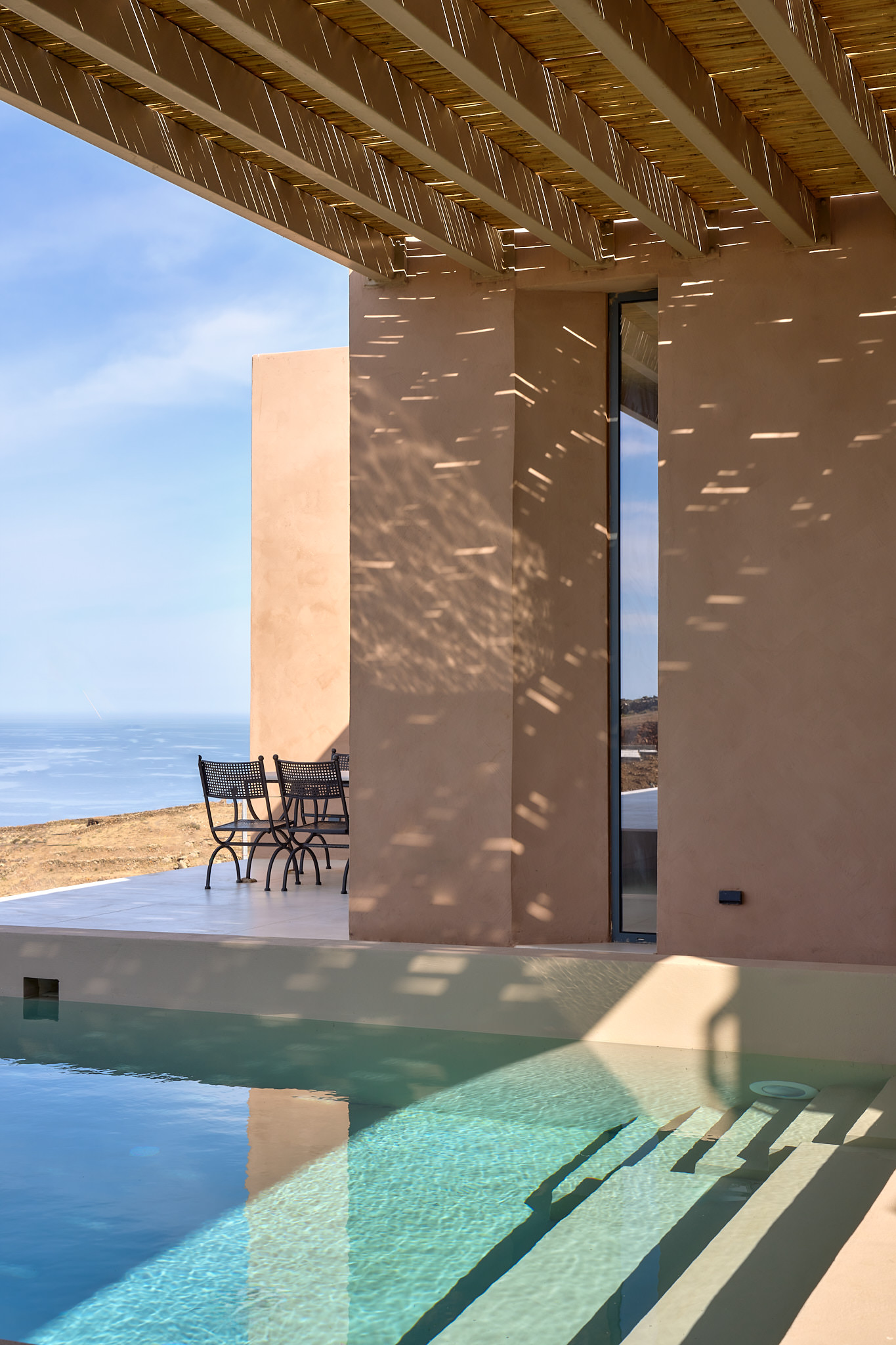Infinity pool settings overlooking the Aegean Sea.