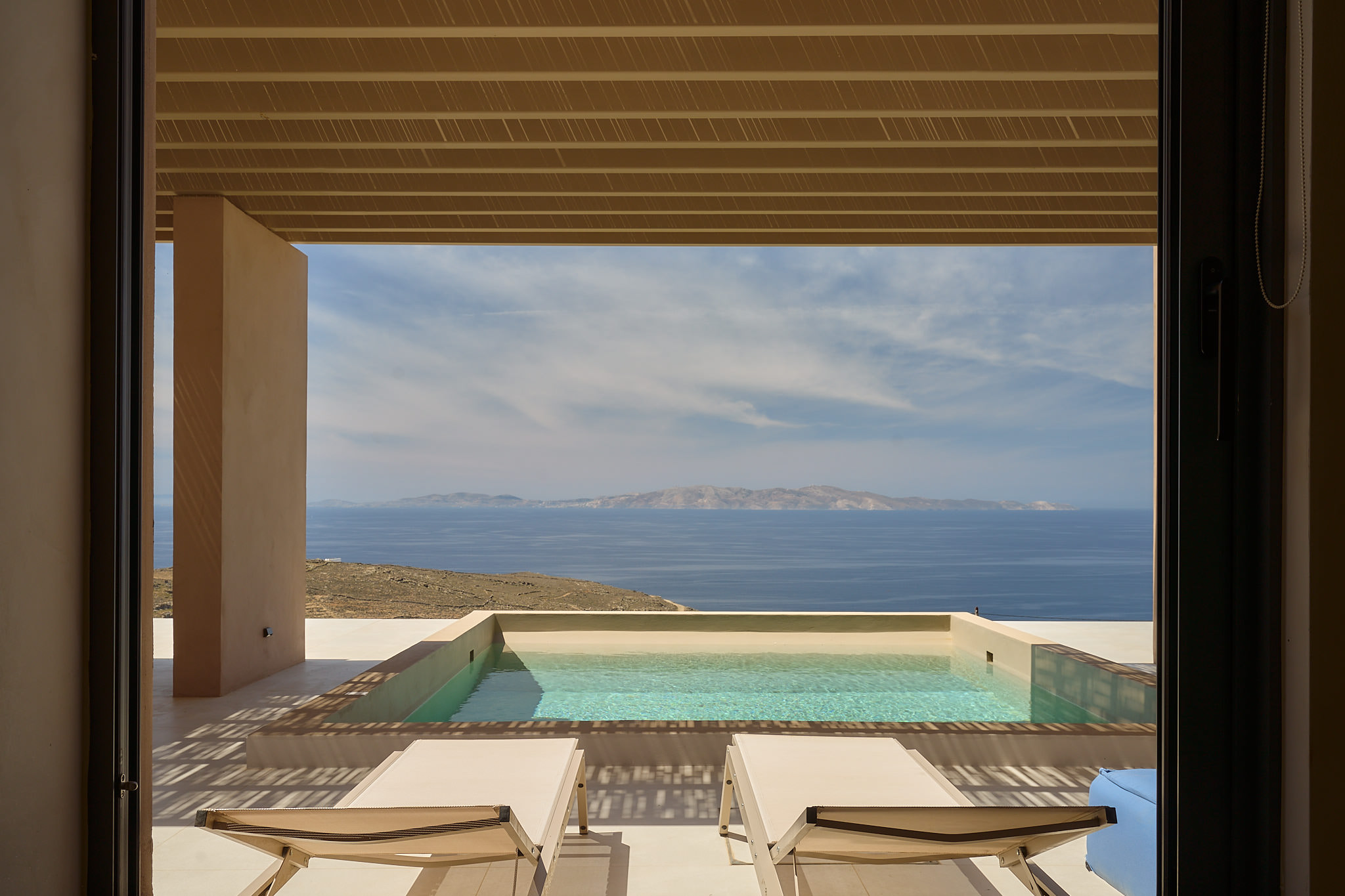 Infinity pool settings overlooking the Aegean Sea.