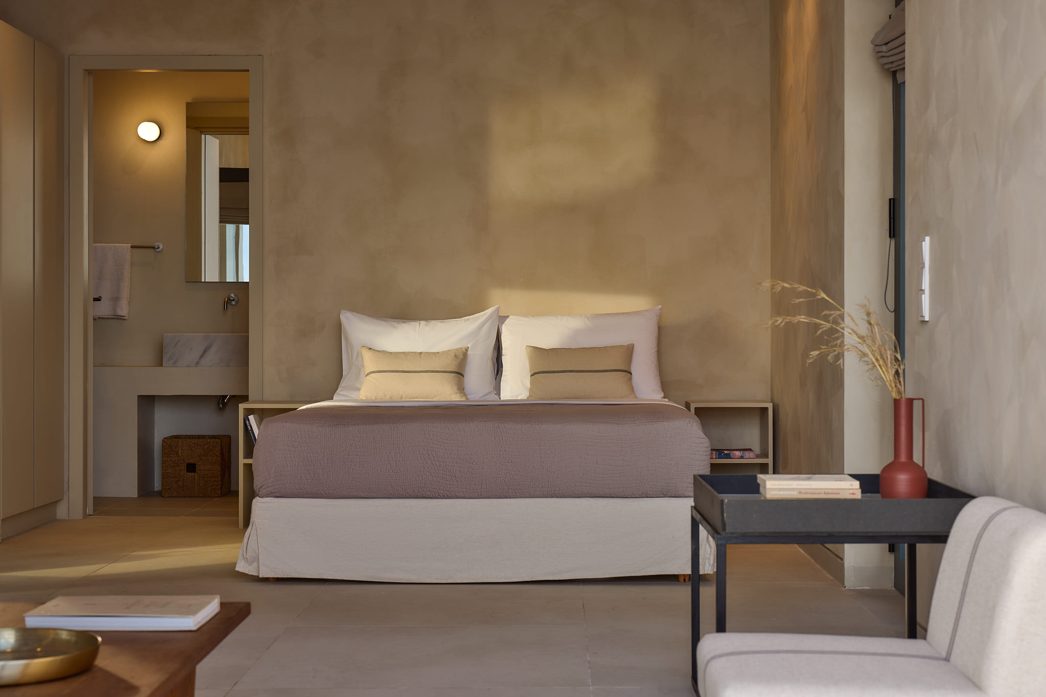 Double bedroom, located in the :4th suite", featuring en-suite bathroom & sofa lounge, with sea views.