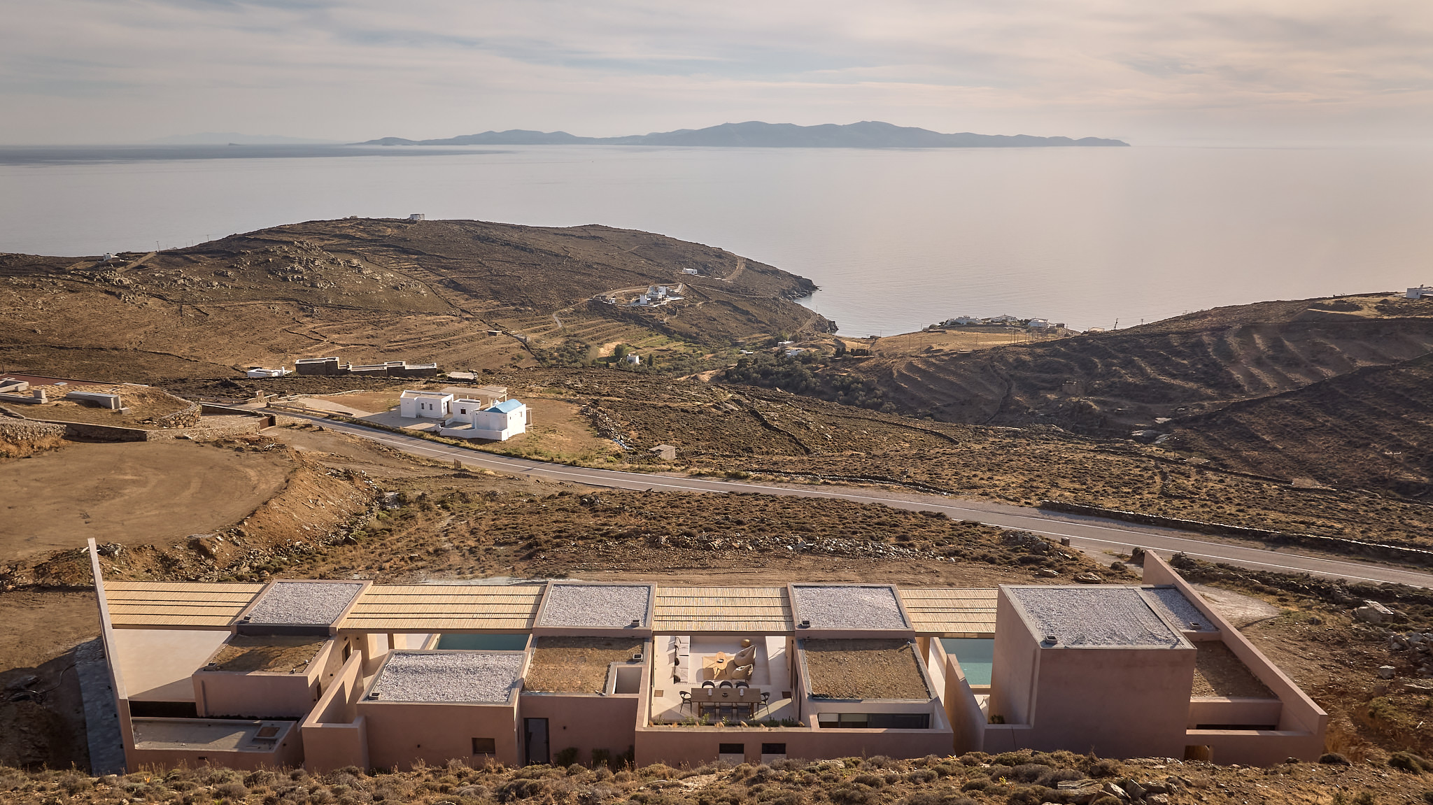 An overview of the iconic villa, overlooking the Aegean Sea.